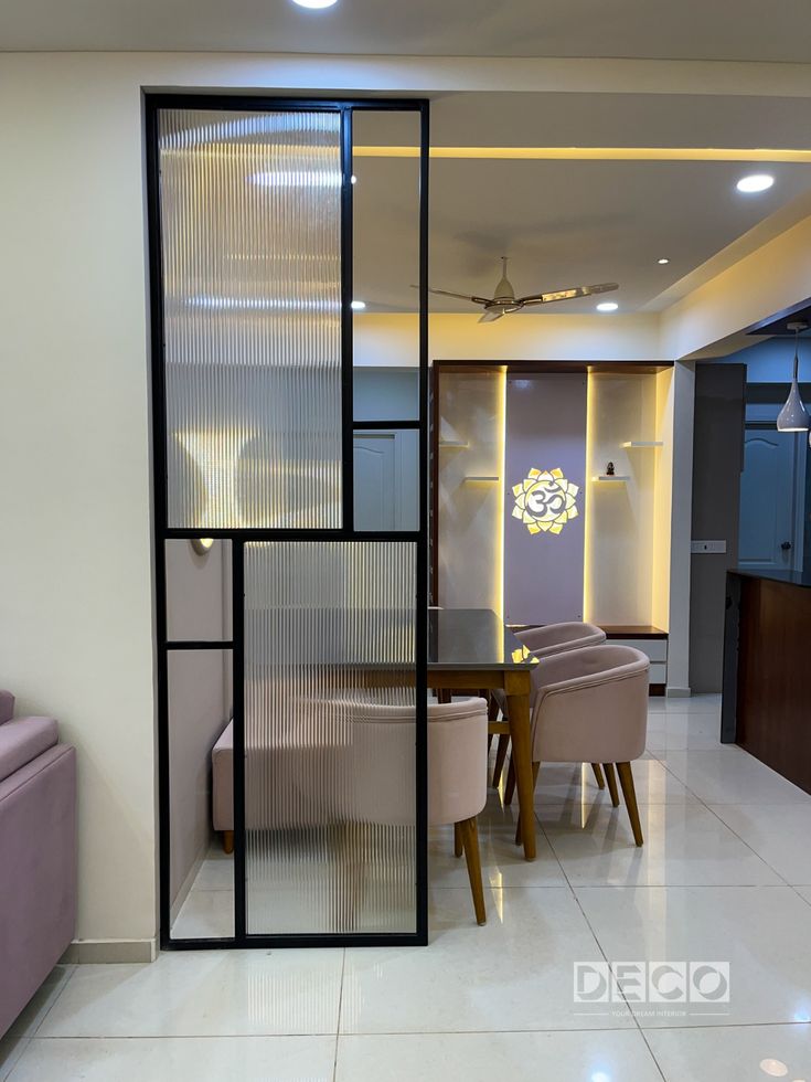 Black framed fluted glass partition in a modern interior