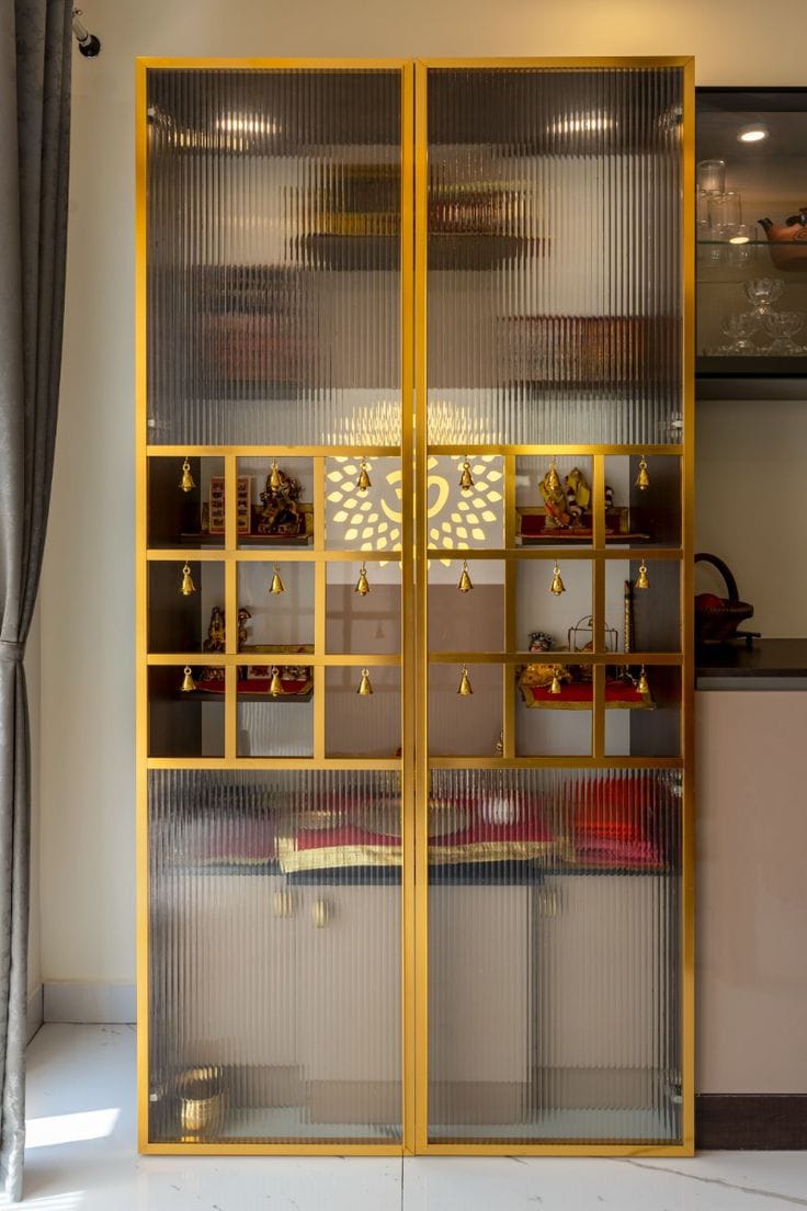Gold framed glass display cabinet with illuminated shelves